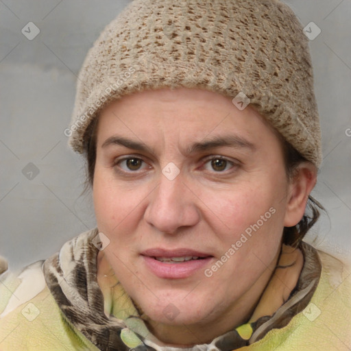 Joyful white adult female with medium  brown hair and blue eyes