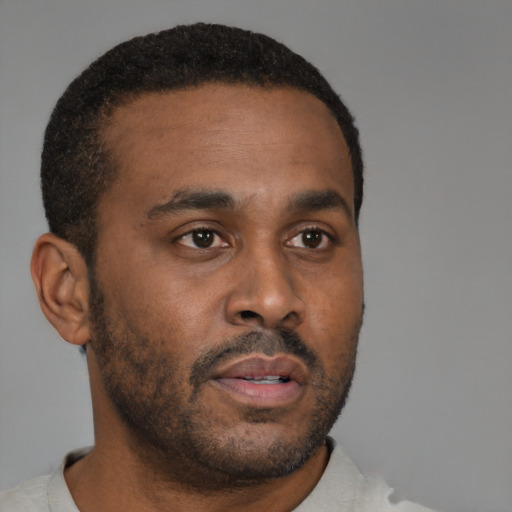 Neutral black young-adult male with short  brown hair and brown eyes