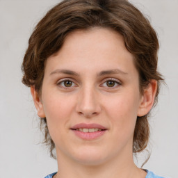 Joyful white young-adult female with medium  brown hair and green eyes