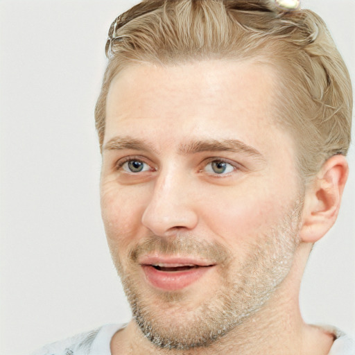 Joyful white adult male with short  brown hair and grey eyes