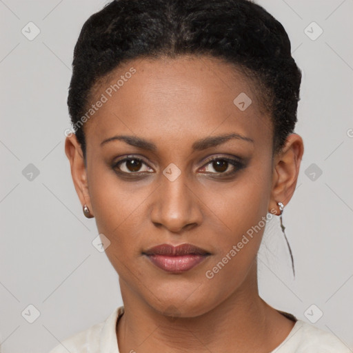 Joyful black young-adult female with short  brown hair and brown eyes