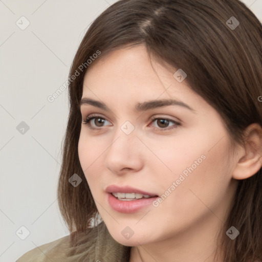 Neutral white young-adult female with long  brown hair and brown eyes