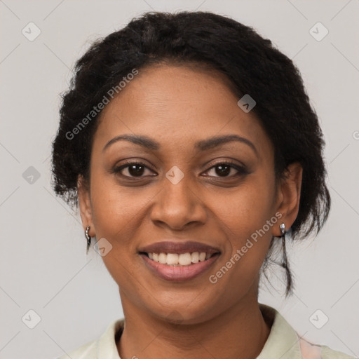 Joyful black young-adult female with short  brown hair and brown eyes