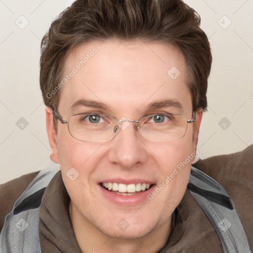 Joyful white adult male with short  brown hair and blue eyes