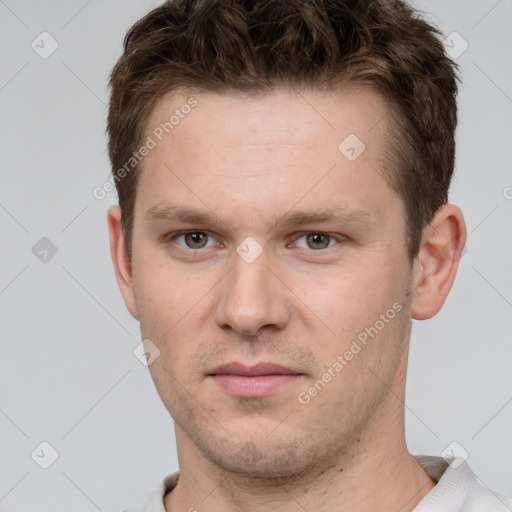 Neutral white young-adult male with short  brown hair and grey eyes