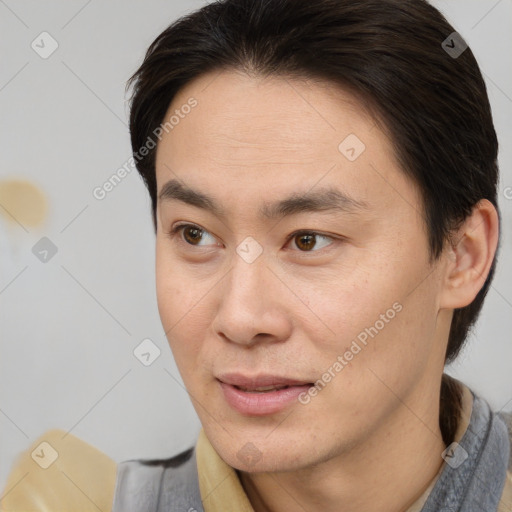 Joyful white young-adult male with medium  brown hair and brown eyes