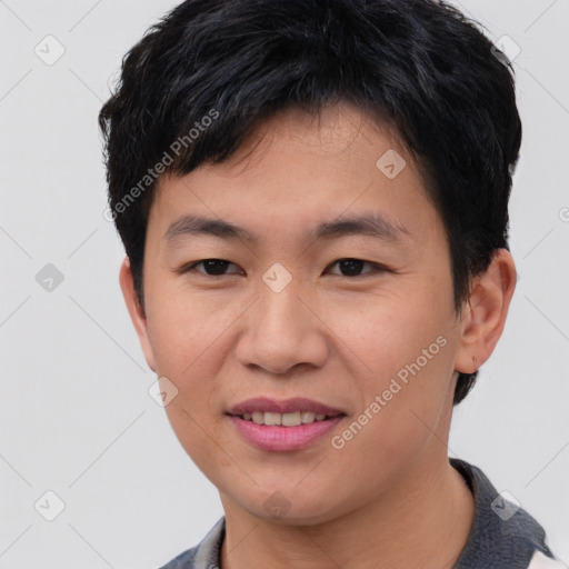 Joyful asian young-adult male with short  brown hair and brown eyes