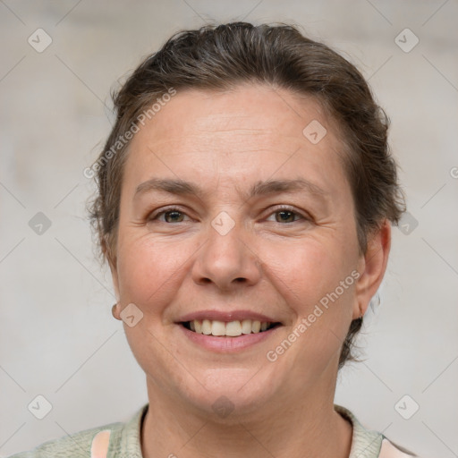 Joyful white adult female with short  brown hair and brown eyes