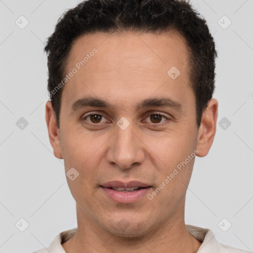 Joyful white adult male with short  brown hair and brown eyes