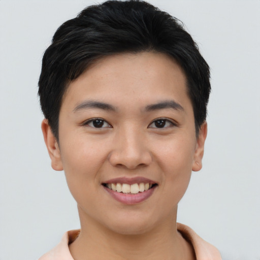 Joyful asian young-adult female with short  black hair and brown eyes