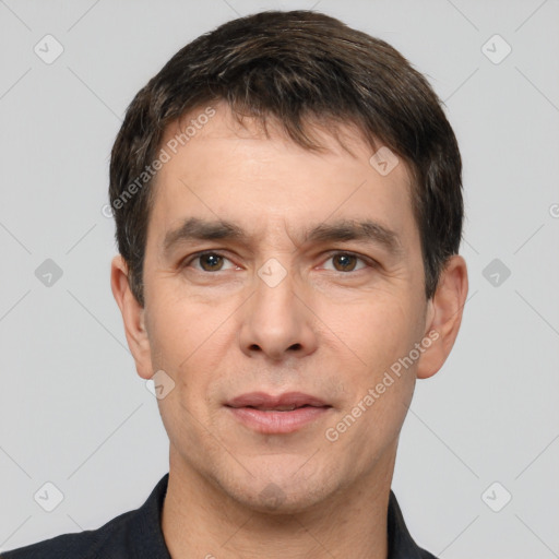 Neutral white young-adult male with short  black hair and brown eyes