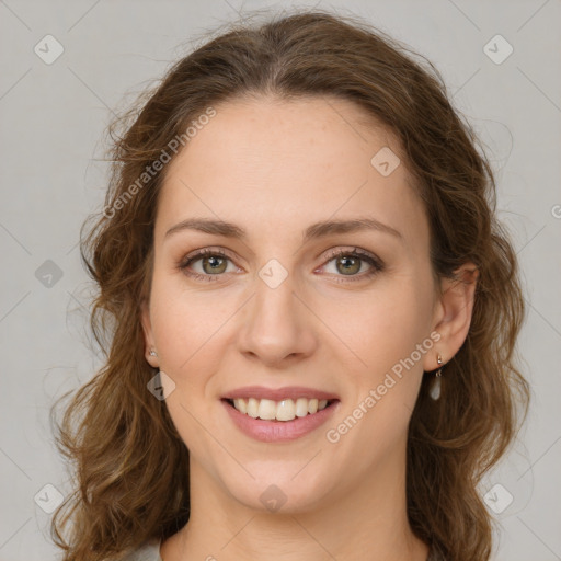 Joyful white young-adult female with long  brown hair and green eyes