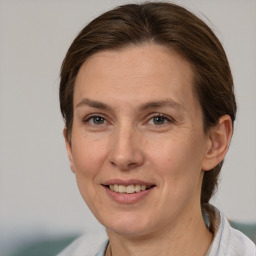 Joyful white adult female with short  brown hair and brown eyes