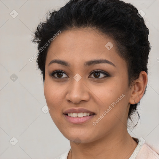 Joyful latino young-adult female with short  black hair and brown eyes