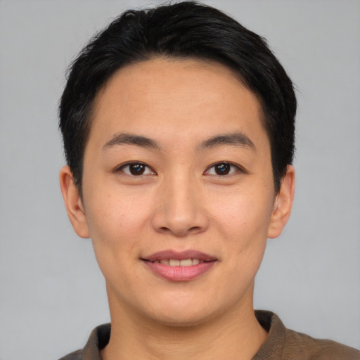 Joyful asian young-adult female with short  black hair and brown eyes