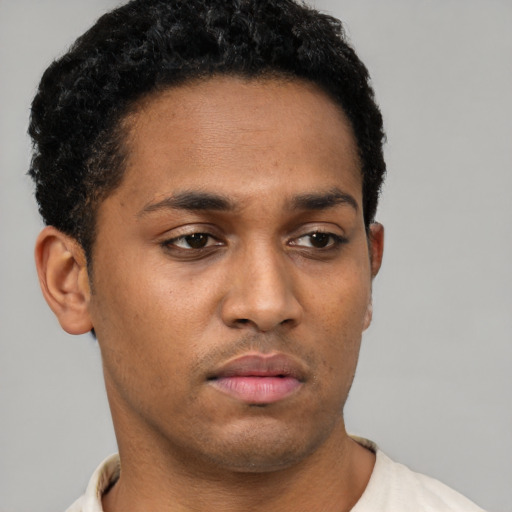 Neutral black young-adult male with short  brown hair and brown eyes