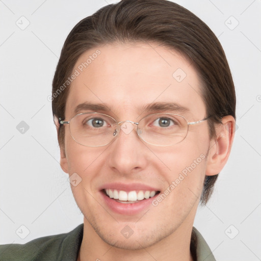 Joyful white adult male with short  brown hair and grey eyes