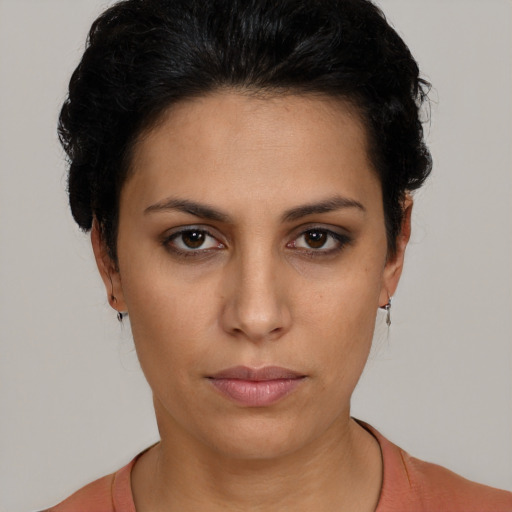 Neutral latino young-adult female with short  black hair and brown eyes