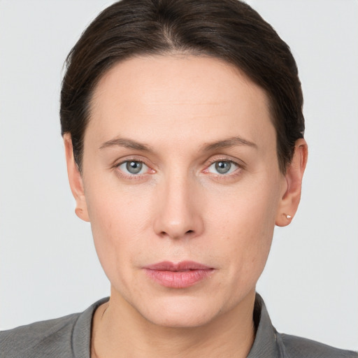 Neutral white young-adult female with short  brown hair and grey eyes