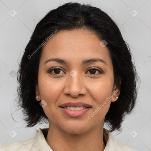 Joyful latino young-adult female with medium  brown hair and brown eyes