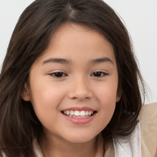 Joyful white child female with long  brown hair and brown eyes