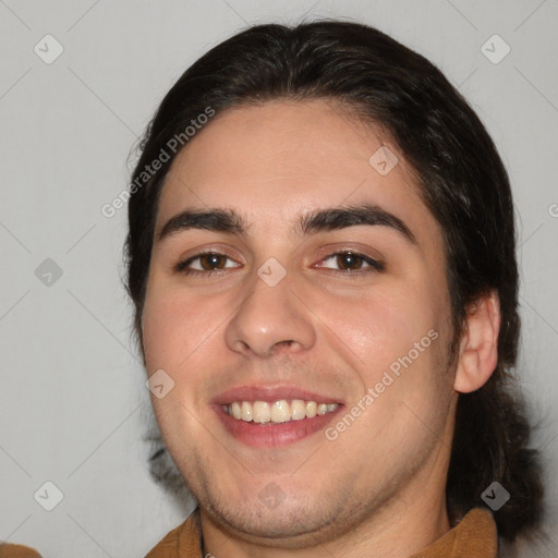 Joyful white young-adult male with medium  brown hair and brown eyes