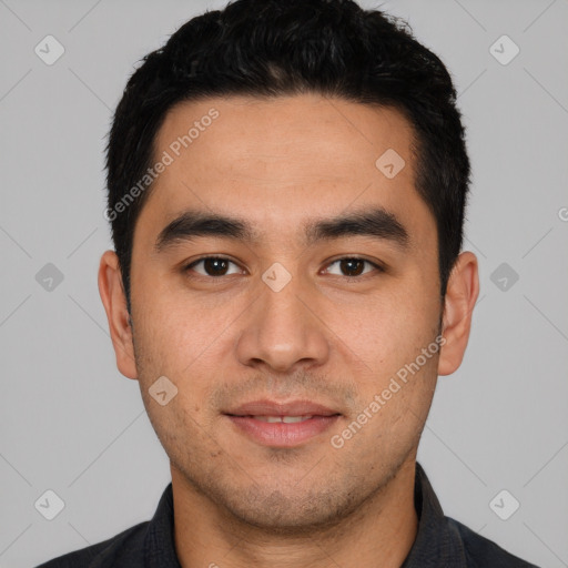 Joyful white young-adult male with short  black hair and brown eyes