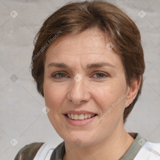 Joyful white adult female with short  brown hair and brown eyes