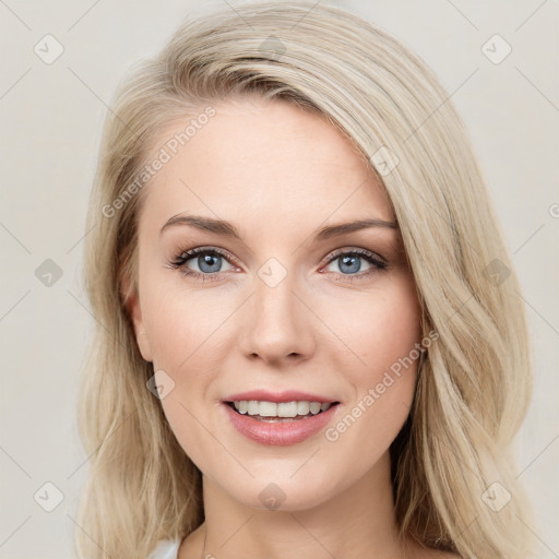 Joyful white young-adult female with medium  brown hair and blue eyes