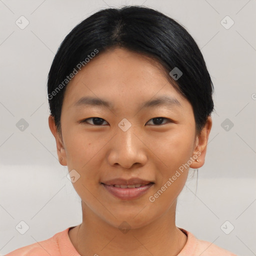 Joyful asian young-adult female with short  black hair and brown eyes