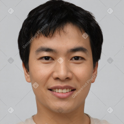 Joyful asian young-adult male with short  black hair and brown eyes