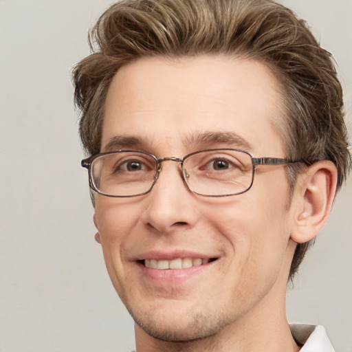 Joyful white adult male with short  brown hair and grey eyes