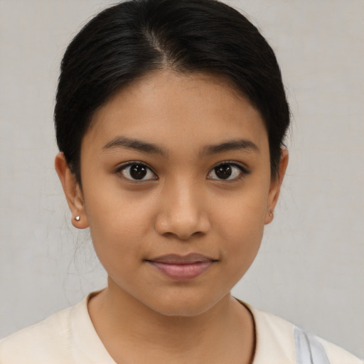 Joyful latino young-adult female with medium  brown hair and brown eyes