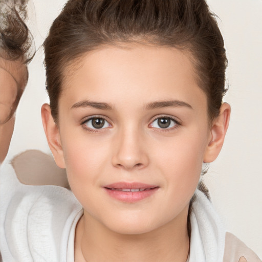 Joyful white child female with medium  brown hair and brown eyes