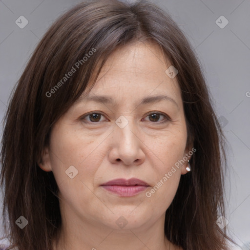 Joyful white adult female with medium  brown hair and brown eyes