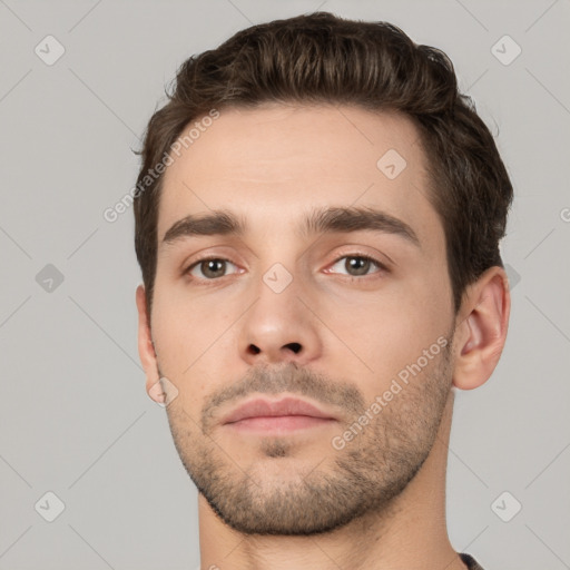 Neutral white young-adult male with short  brown hair and brown eyes