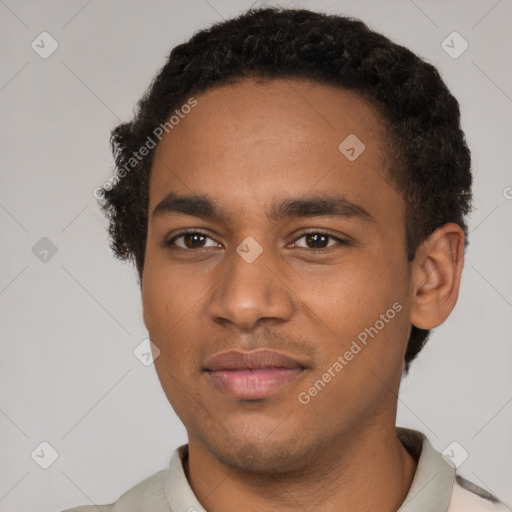 Joyful black young-adult male with short  brown hair and brown eyes