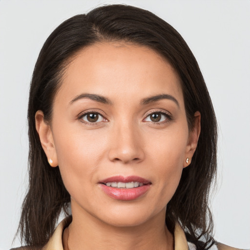 Joyful white young-adult female with long  brown hair and brown eyes