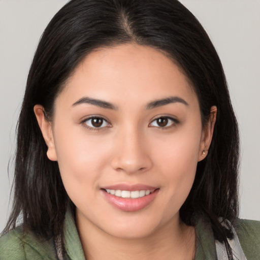 Joyful white young-adult female with medium  brown hair and brown eyes