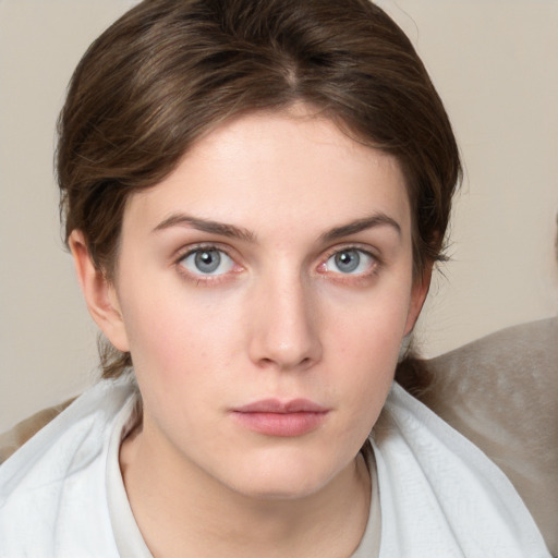 Neutral white young-adult female with medium  brown hair and blue eyes