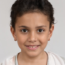 Joyful white child female with short  brown hair and brown eyes