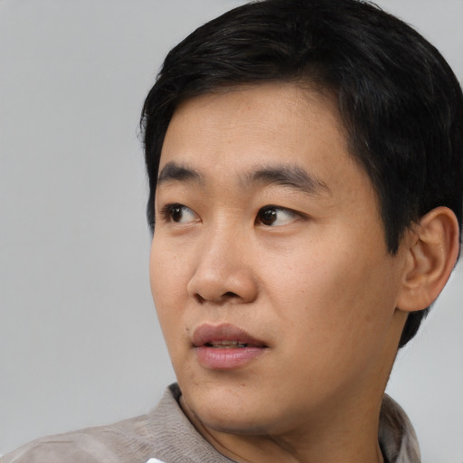 Neutral asian young-adult male with short  black hair and brown eyes
