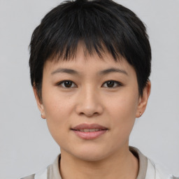 Joyful asian young-adult female with short  brown hair and brown eyes