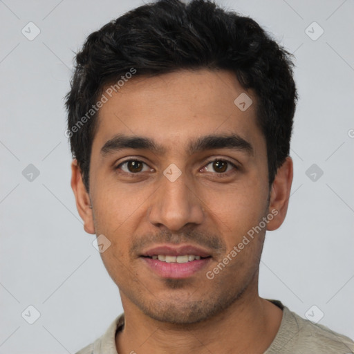 Joyful white young-adult male with short  black hair and brown eyes