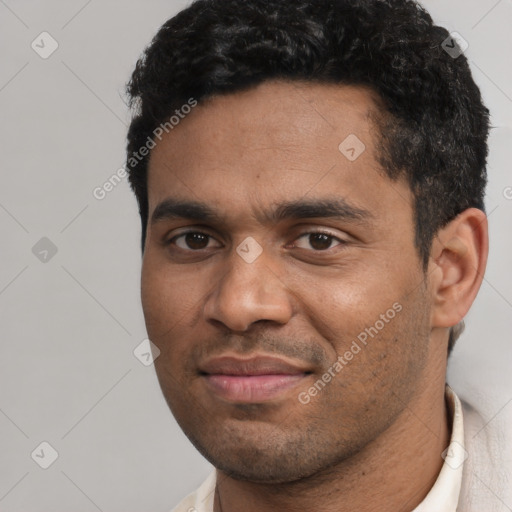 Joyful white adult male with short  black hair and brown eyes