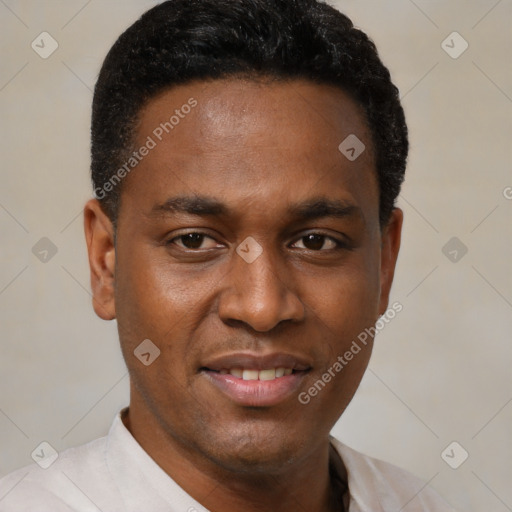 Joyful black young-adult male with short  black hair and brown eyes