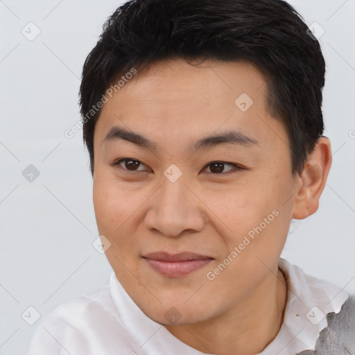 Joyful asian young-adult male with short  black hair and brown eyes