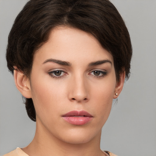 Neutral white young-adult female with short  brown hair and brown eyes