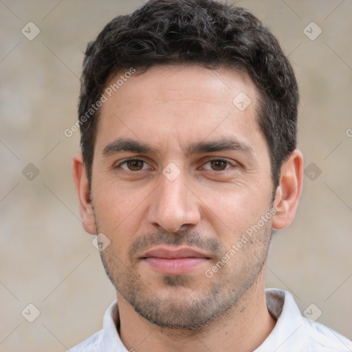 Joyful white young-adult male with short  black hair and brown eyes