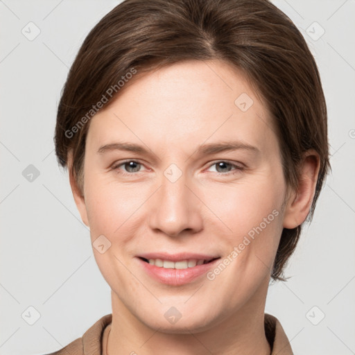 Joyful white young-adult female with short  brown hair and grey eyes